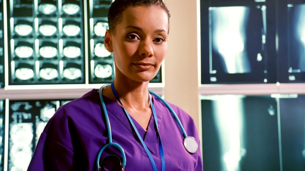 woman in front of x-rays