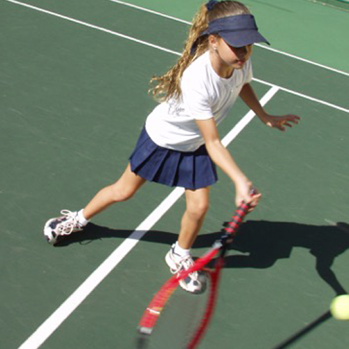 young girl playing tennis.