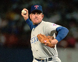 baseball player throwing a pitch.