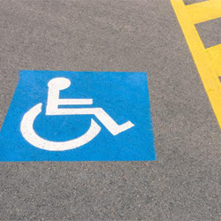 Handicap parking on spot in parking lot.