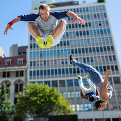 Photo of kids jumping high.