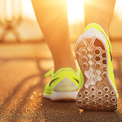 Close up of bright yellow tennis shoes.