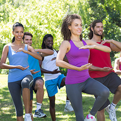 Women participating in Tai Chi movements.