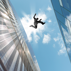 Man jumping from one top of building to another.