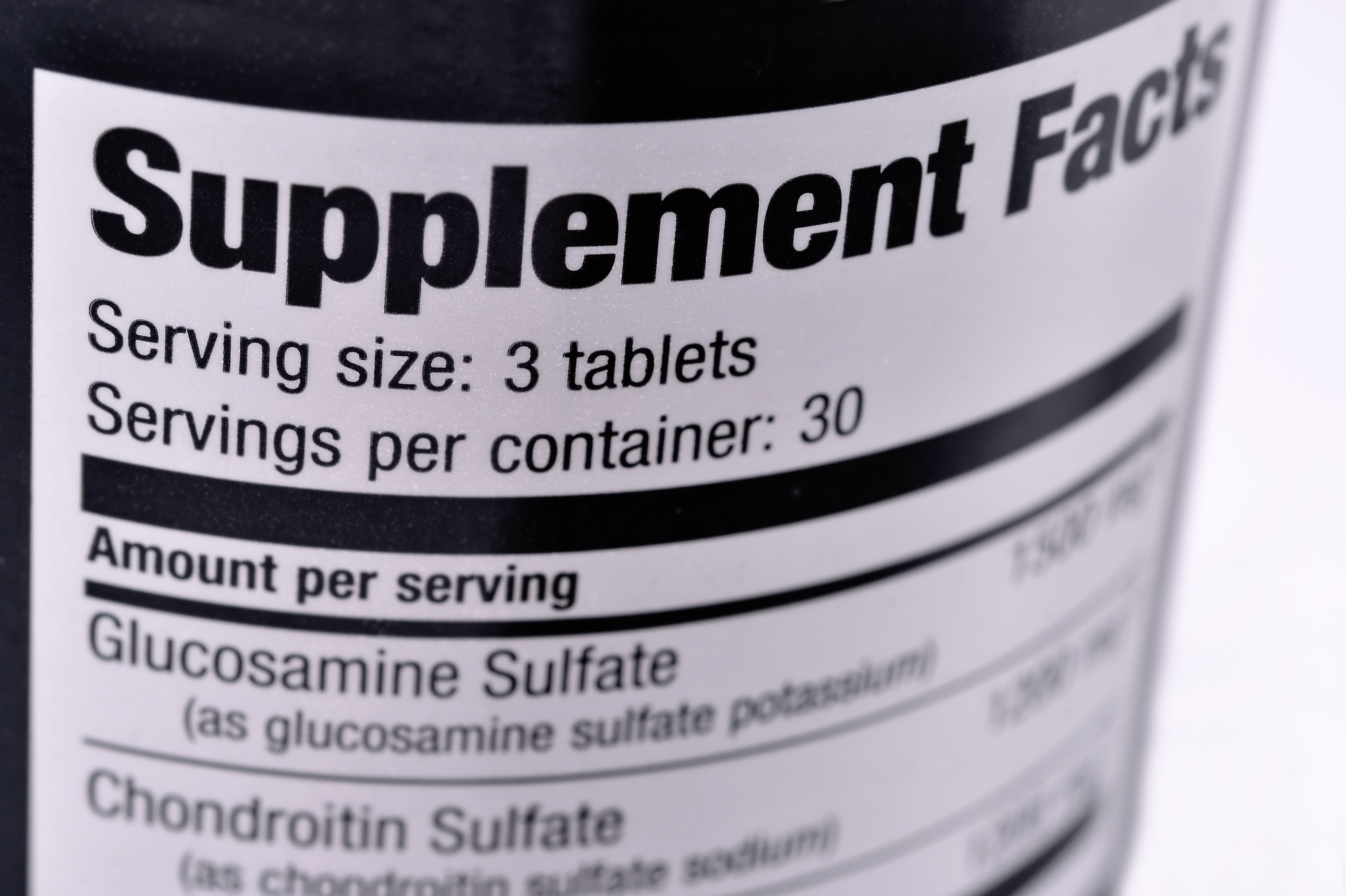 Closeup of a bottle of nutritional supplements.