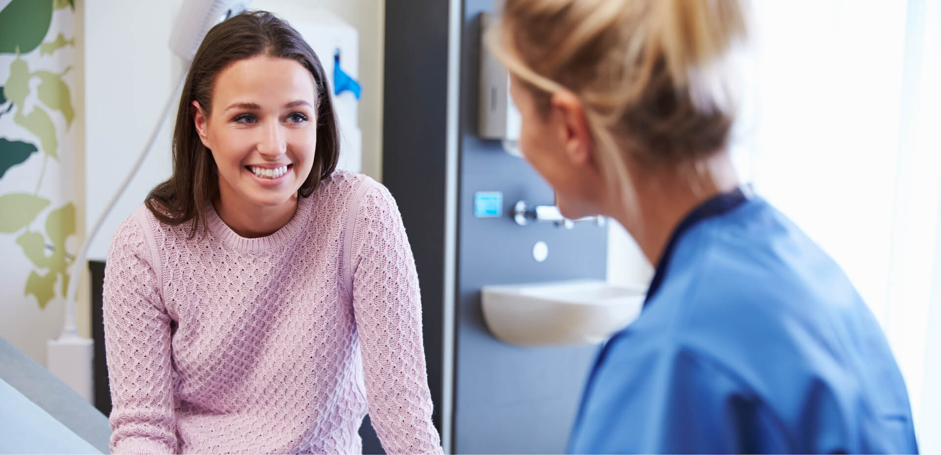Woman talking to a doctor.