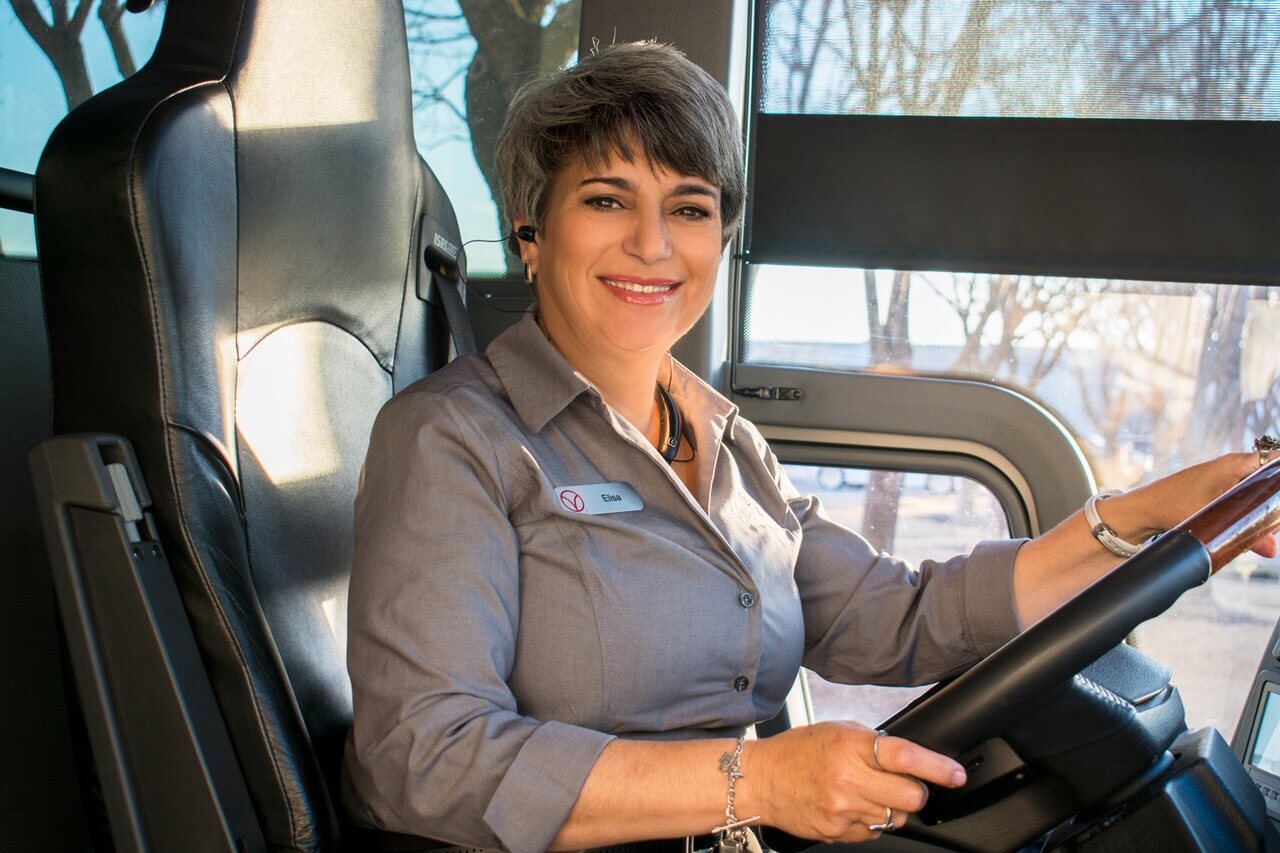 Elisa Morales driving a motor coach.