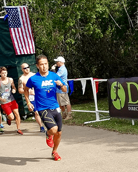 Action shot of Iram participating in a 10K.