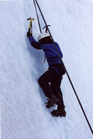 Man climbing an icy cliff.