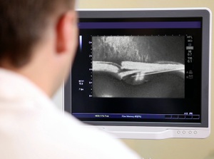 A doctor observes an x-ray