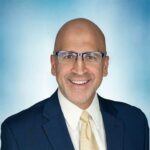 Headshot of K. Nimr Ikram, D.O..