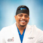 Headshot of Dr. Jean Louis Benae, MD, FAANS, FCNS, FICS.